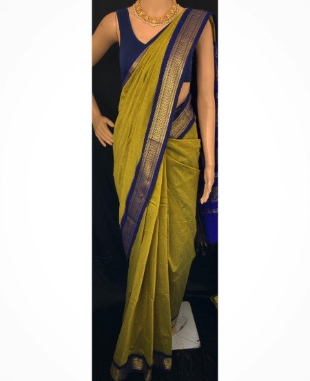 PEAR GREEN COTTON SILK SAREE WITH BLUE BORDER.