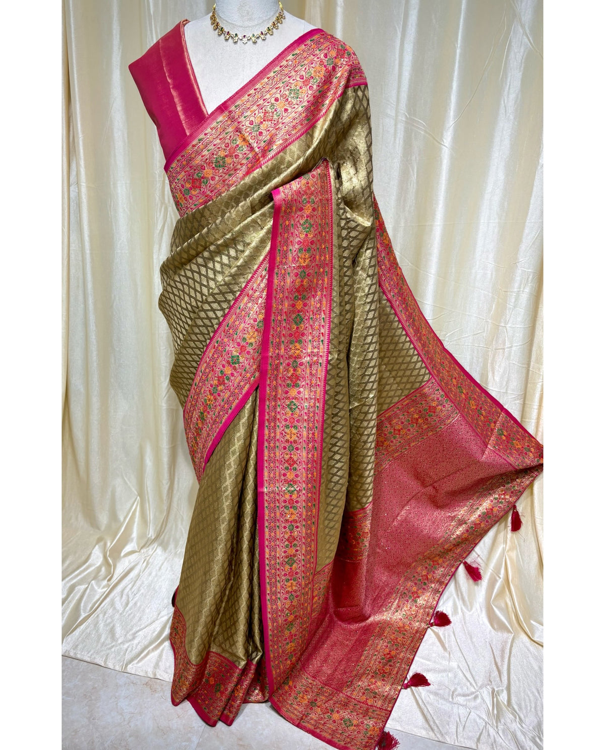 Copper gold diamond tissue silk saree with red border.