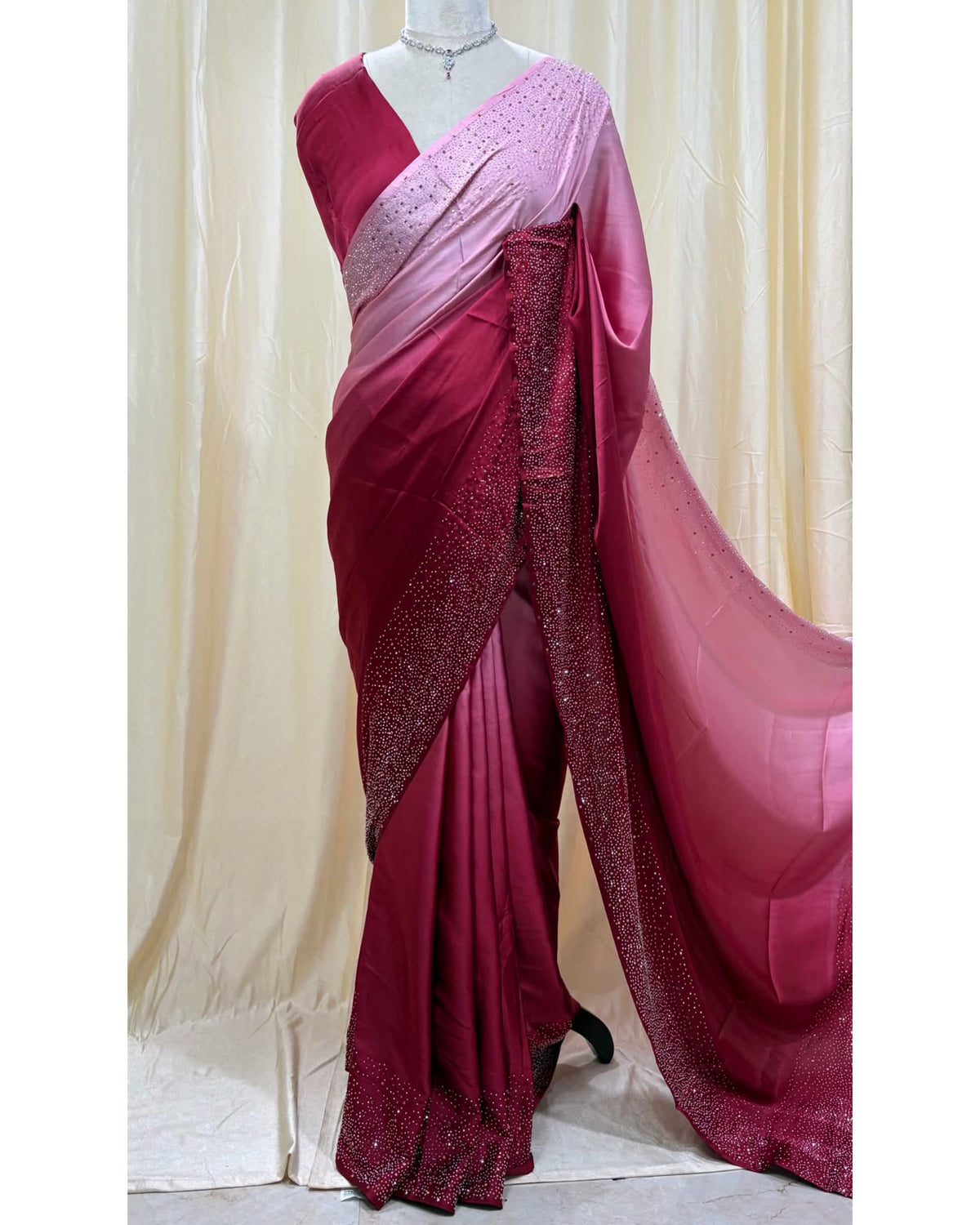 Pink dual shaded satin silk saree comes with stone work all over saree.