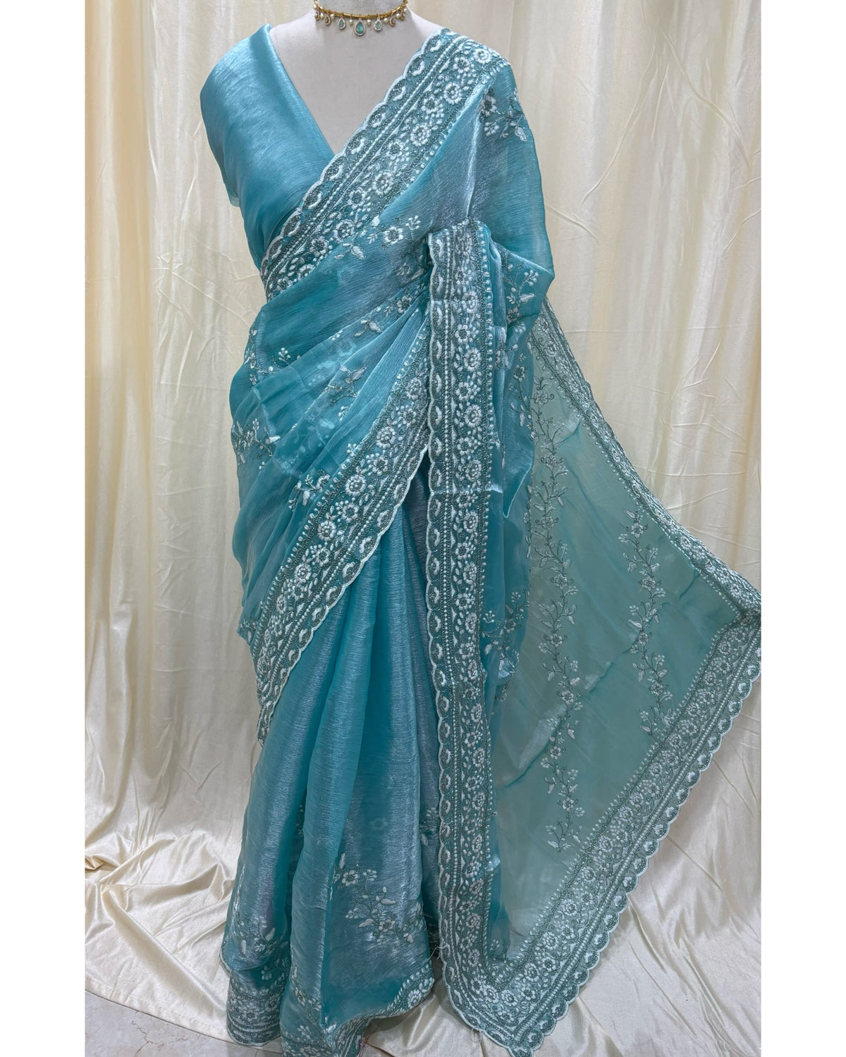 Sky blue soft organza saree with white embroidery all over saree.