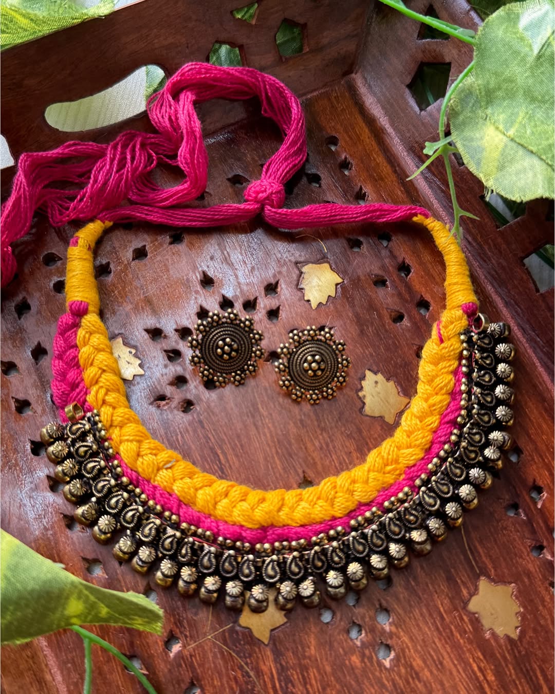 Yellow pink thread braid necklace with antique touch. Comes with earrings