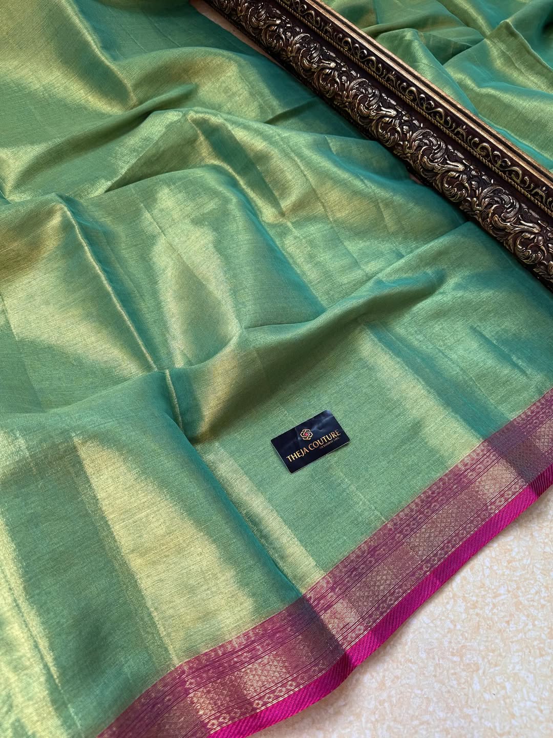 TURQUOISE GREEN SOFT TISSUE SAREE COMES WITH PINK BORDER