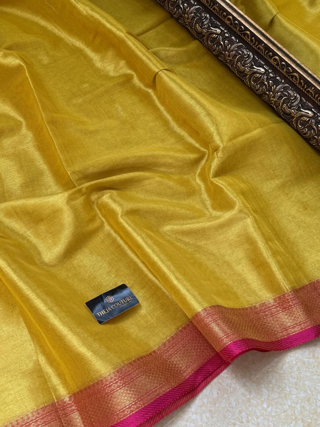 LEMON YELLOW SOFT TISSUE SAREE COMES WITH PINK BORDER