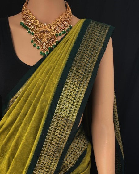 PEAR GREEN COTTON SILK SAREE WITH GREEN BORDER.