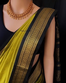 PEAR GREEN COTTON SILK SAREE WITH BLACK BORDER.