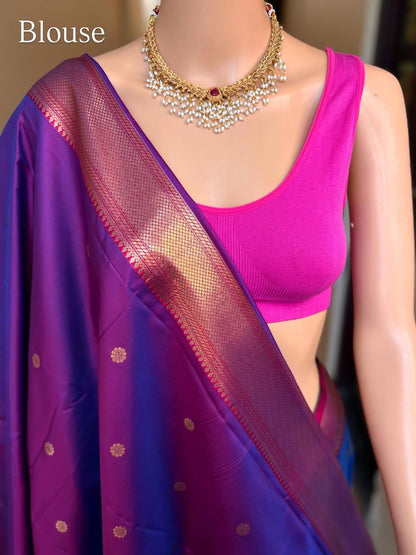 Peacock blue art silk saree comes with pink golden zari weave border.