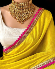 YELLOW TISSUE SAREE WITH PINK LACE