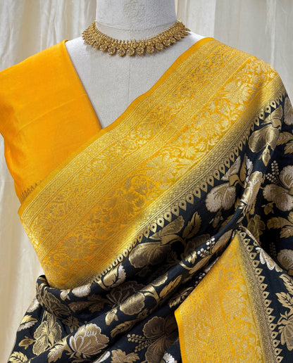 Black brocade silk saree with yellow zari border.