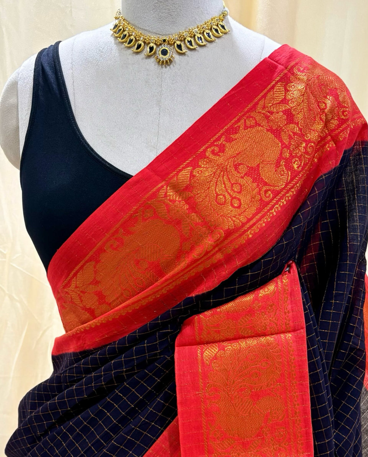 Black kattam sungudi cotton sarees with red orange border.