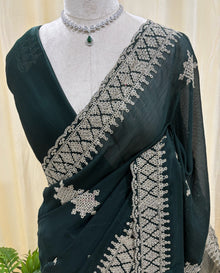 Bottle green georgette saree with golden white embroidery.