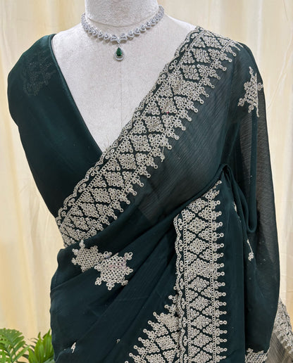 Bottle green georgette saree with golden white embroidery.