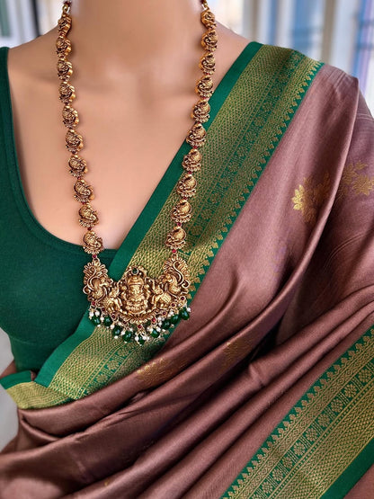 SAND BROWN ART SILK COMES WITH BOTTLE GREEN GOLDEN ZARI WEAVE BORDER
