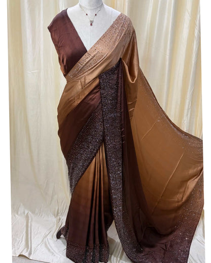 Coffee brown dual shaded satin silk saree comes with stone work all over saree.