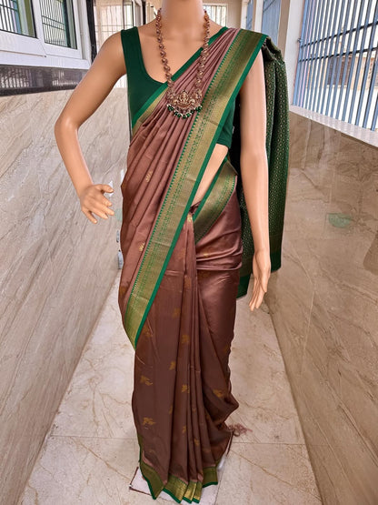 SAND BROWN ART SILK COMES WITH BOTTLE GREEN GOLDEN ZARI WEAVE BORDER