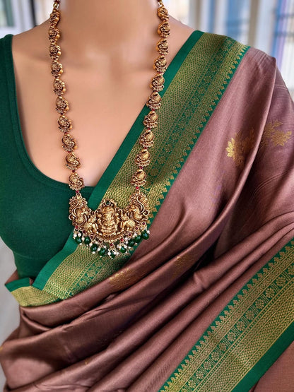 SAND BROWN ART SILK COMES WITH BOTTLE GREEN GOLDEN ZARI WEAVE BORDER