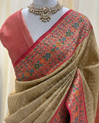Golden diamond tissue silk saree with red border.
