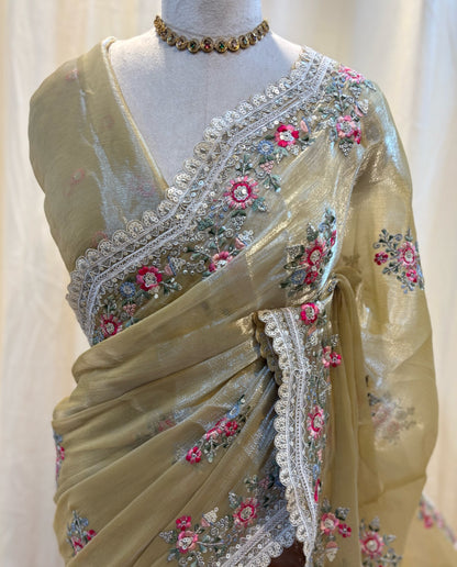 Golden yellow soft organza saree with white embroidery border.