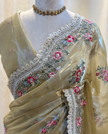 Golden yellow soft organza saree with white embroidery border.