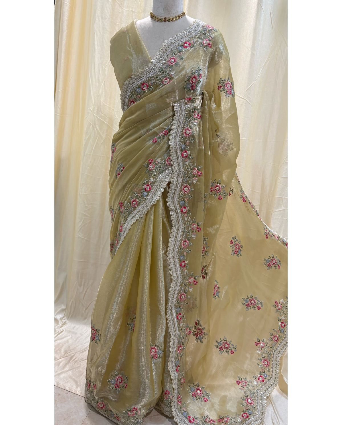 Golden yellow soft organza saree with white embroidery border.