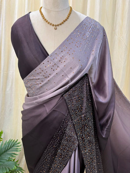 Grey dual shaded satin silk saree comes with stone work all over saree.