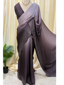 Grey dual shaded satin silk saree comes with stone work all over saree.