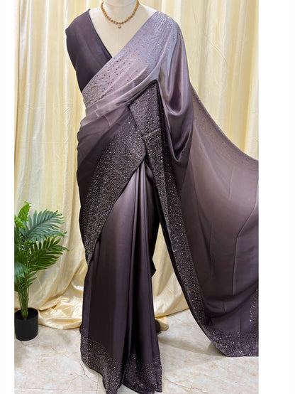 Grey dual shaded satin silk saree comes with stone work all over saree.