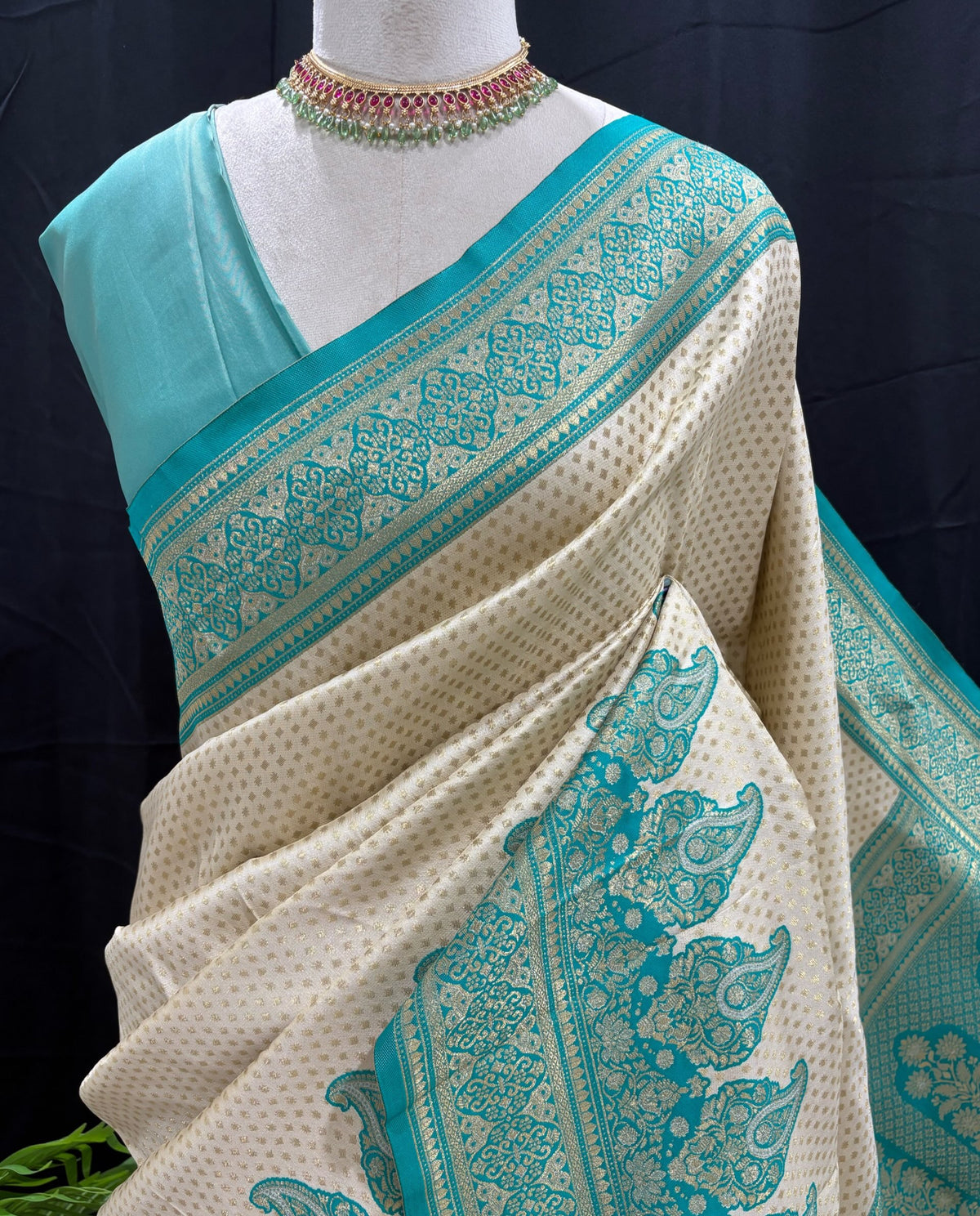 Ivory white brocade silk saree with teal blue border