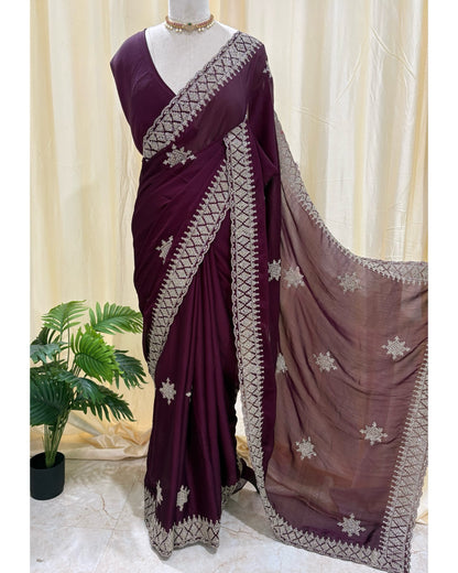 Magenta georgette saree with golden white embroidery.