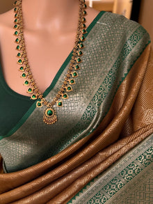 MUSTARD ART SILK SAREE WITH CONTRAST BOTTLE GREEN ZARI BORDER