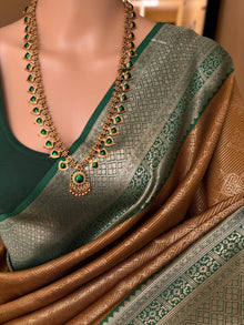 MUSTARD ART SILK SAREE WITH CONTRAST BOTTLE GREEN ZARI BORDER