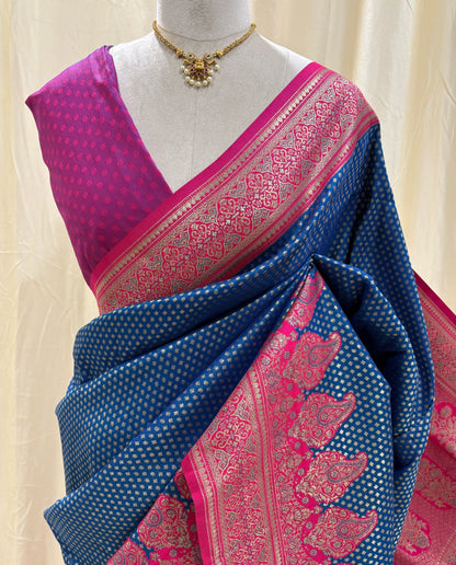 Navy blue brocade art silk saree comes with Rani pink border and pallu.