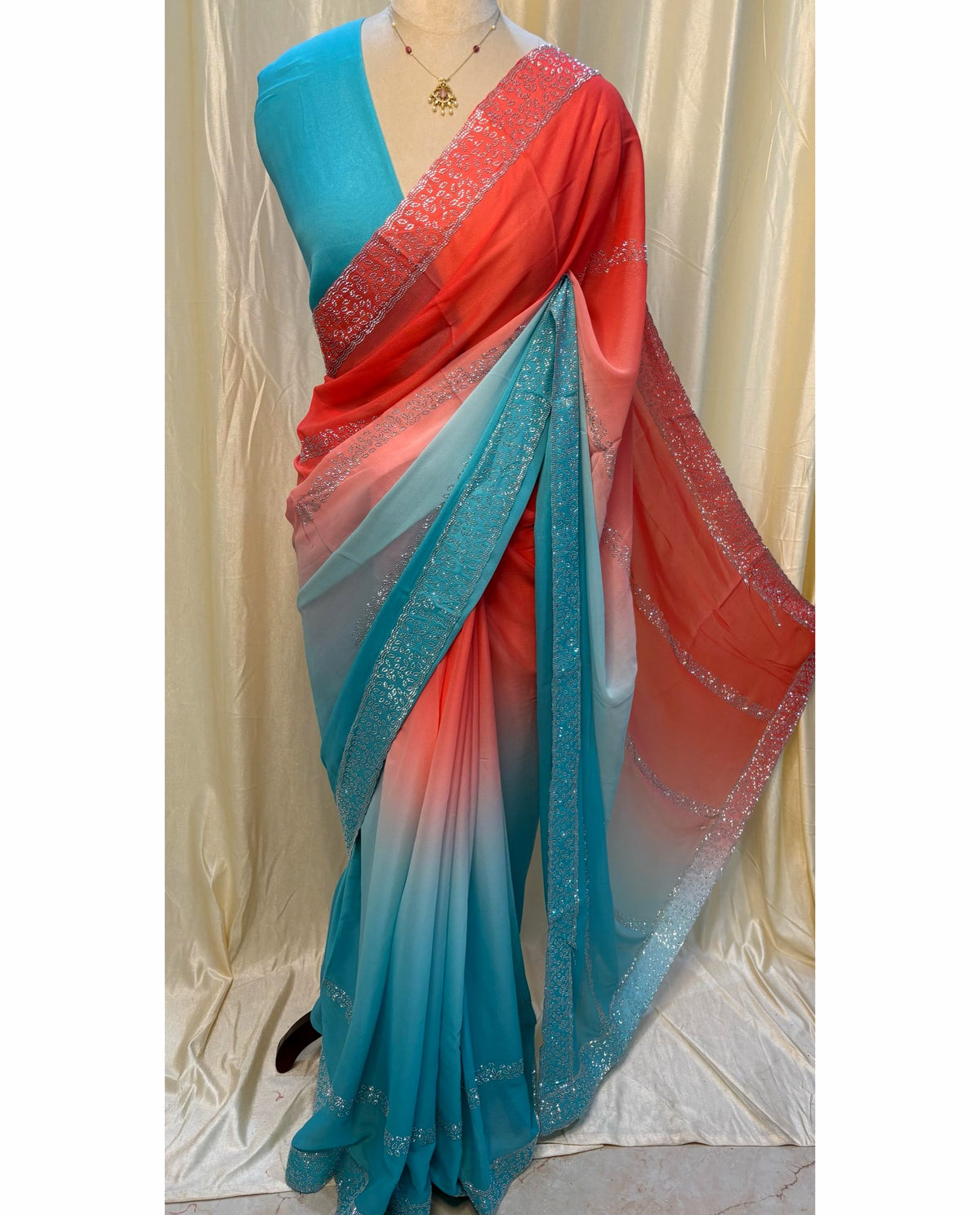 Orange blue half and half georgette saree.