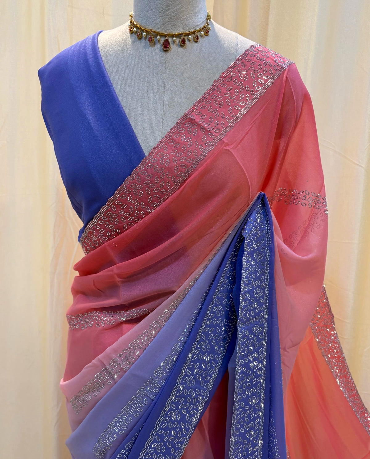 Peach blue half and half georgette saree.