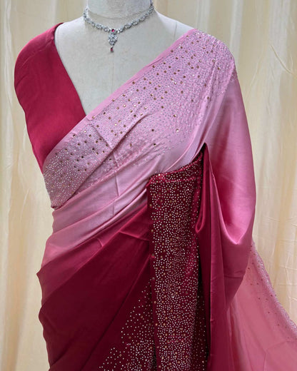 Pink dual shaded satin silk saree comes with stone work all over saree.