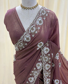Rose brown georgette saree with white embroidery .