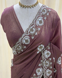Rose brown georgette saree with white embroidery .
