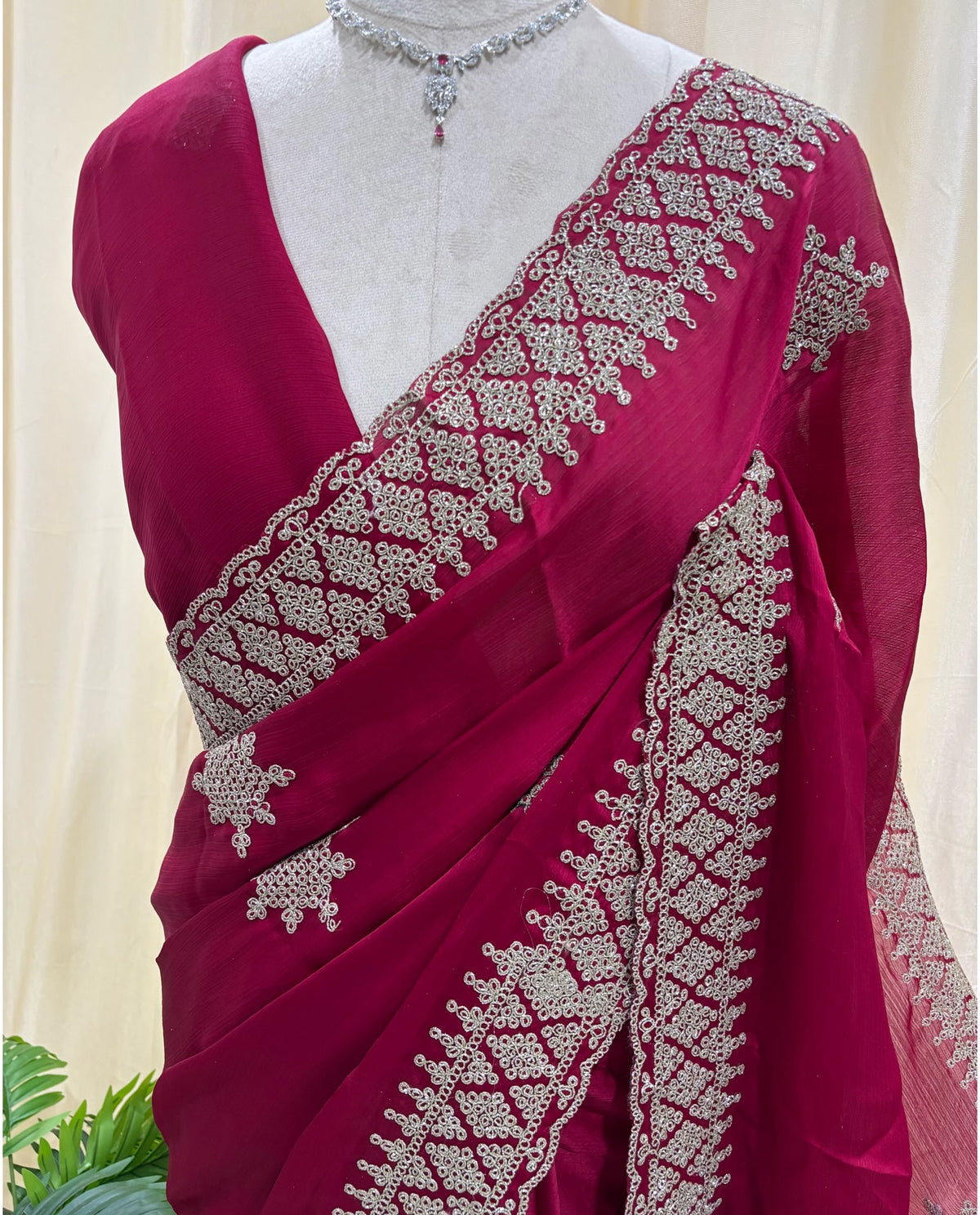 Rose pink georgette saree with golden white embroidery .