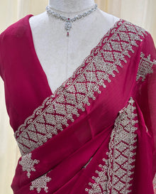 Rose pink georgette saree with golden white embroidery .