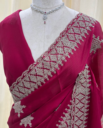 Rose pink georgette saree with golden white embroidery .