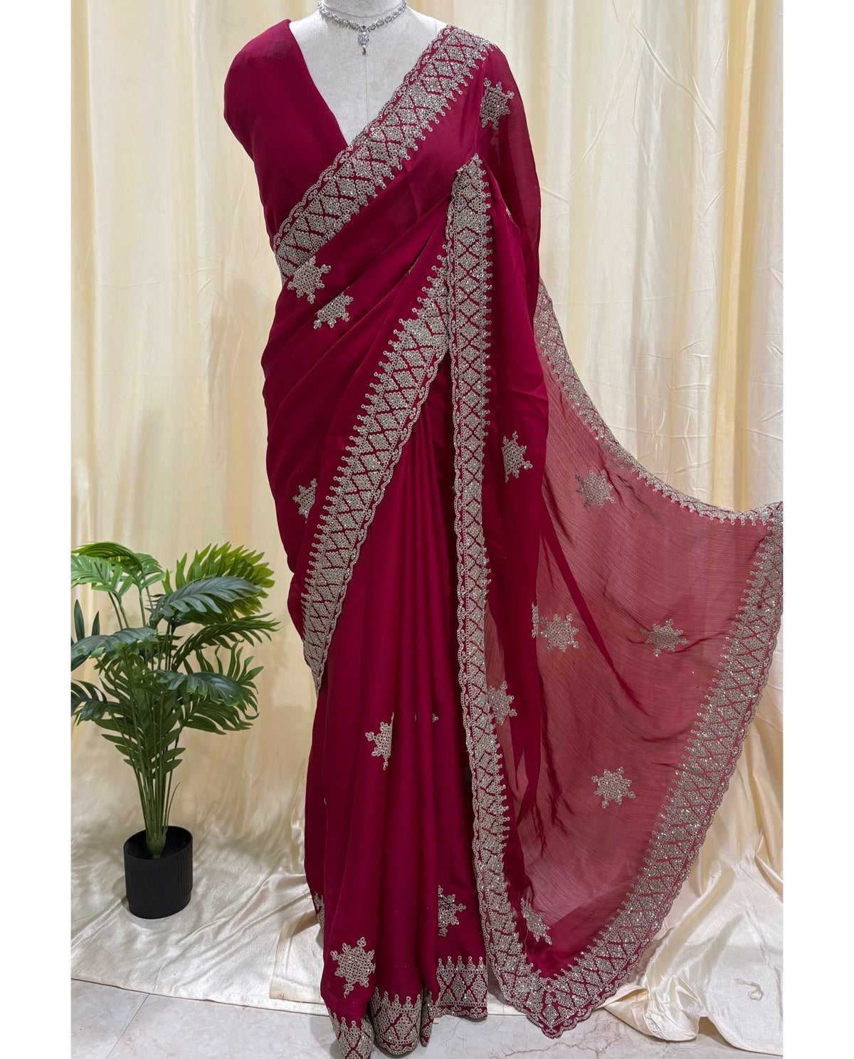 Rose pink georgette saree with golden white embroidery .