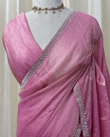 Rose pink georgette saree with white saree.