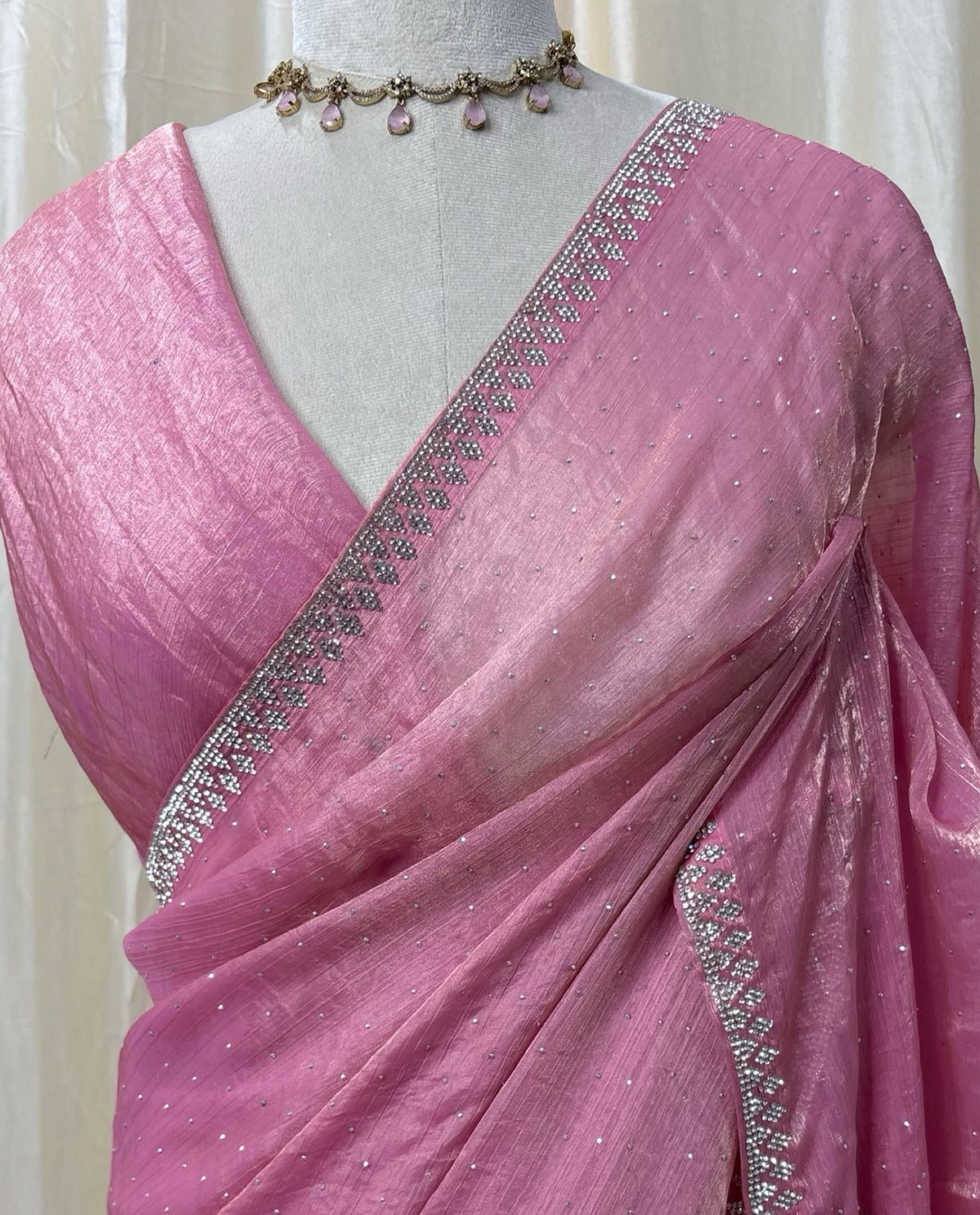 Rose pink georgette saree with white saree.