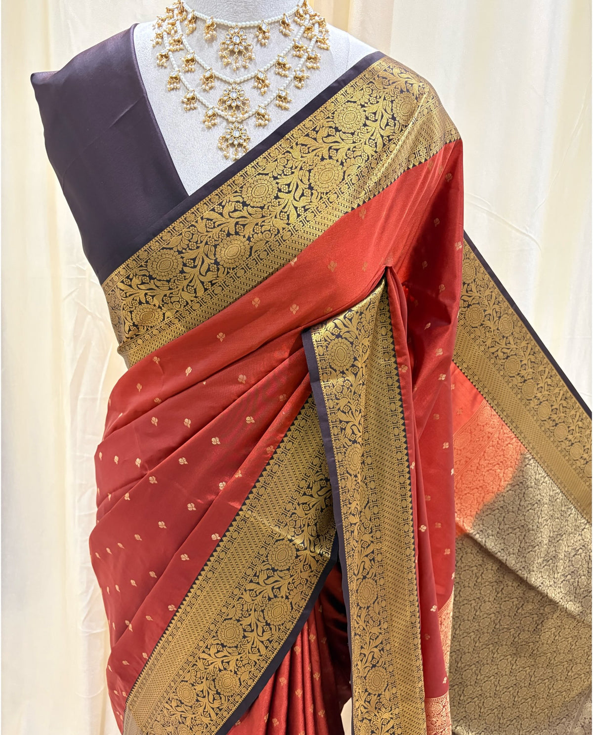 Rust orange art silk sarees with coffee brown zari border.