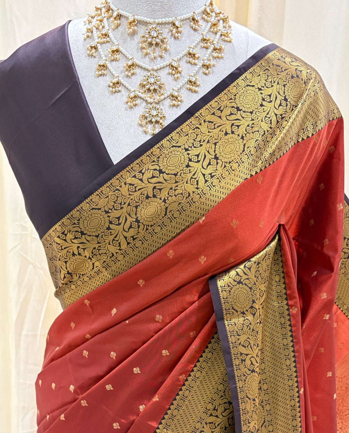 Rust orange art silk sarees with coffee brown zari border.
