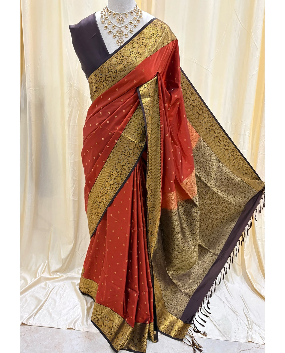 Rust orange art silk sarees with coffee brown zari border.
