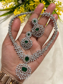 Silver stone necklace with greenstone comes with earrings.