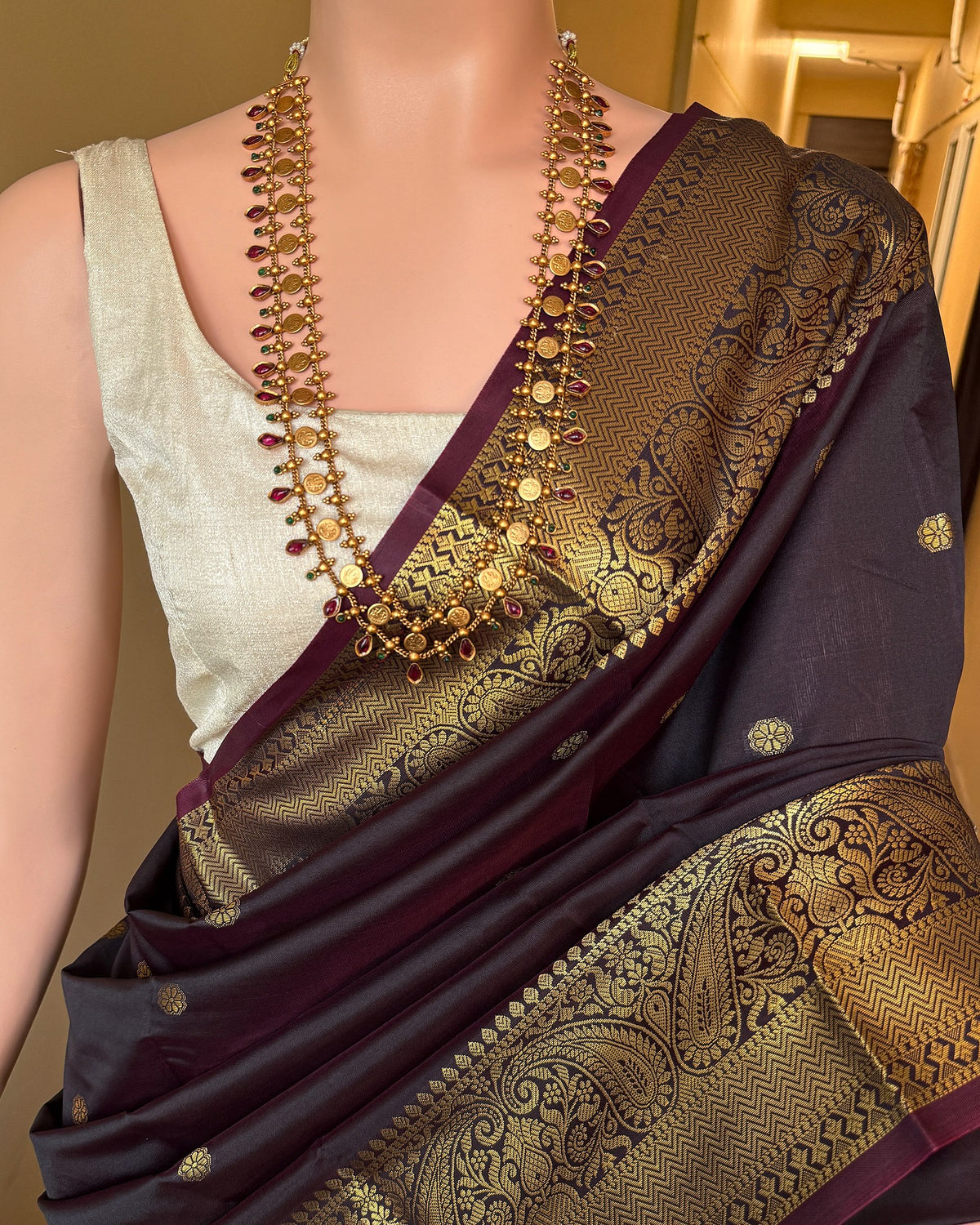 DARK WINE BLACK ART SILK SAREE WITH GOLDEN ZARI BORDER.