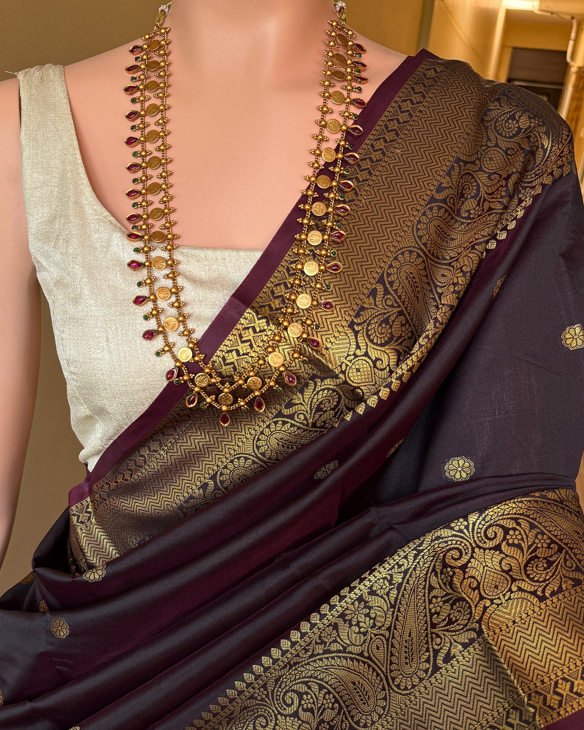 DARK WINE BLACK ART SILK SAREE WITH GOLDEN ZARI BORDER.