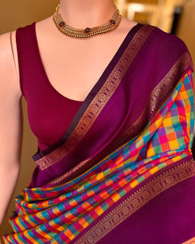 Multi colour checks art silk saree with contrast magenta border.
