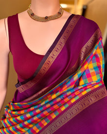 Multi colour checks art silk saree with contrast magenta border.